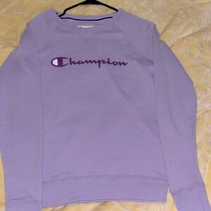 A light purple color  The brand is champion the size is xs